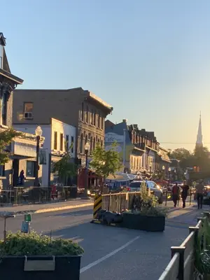Patios along Hunter Street West at sunset